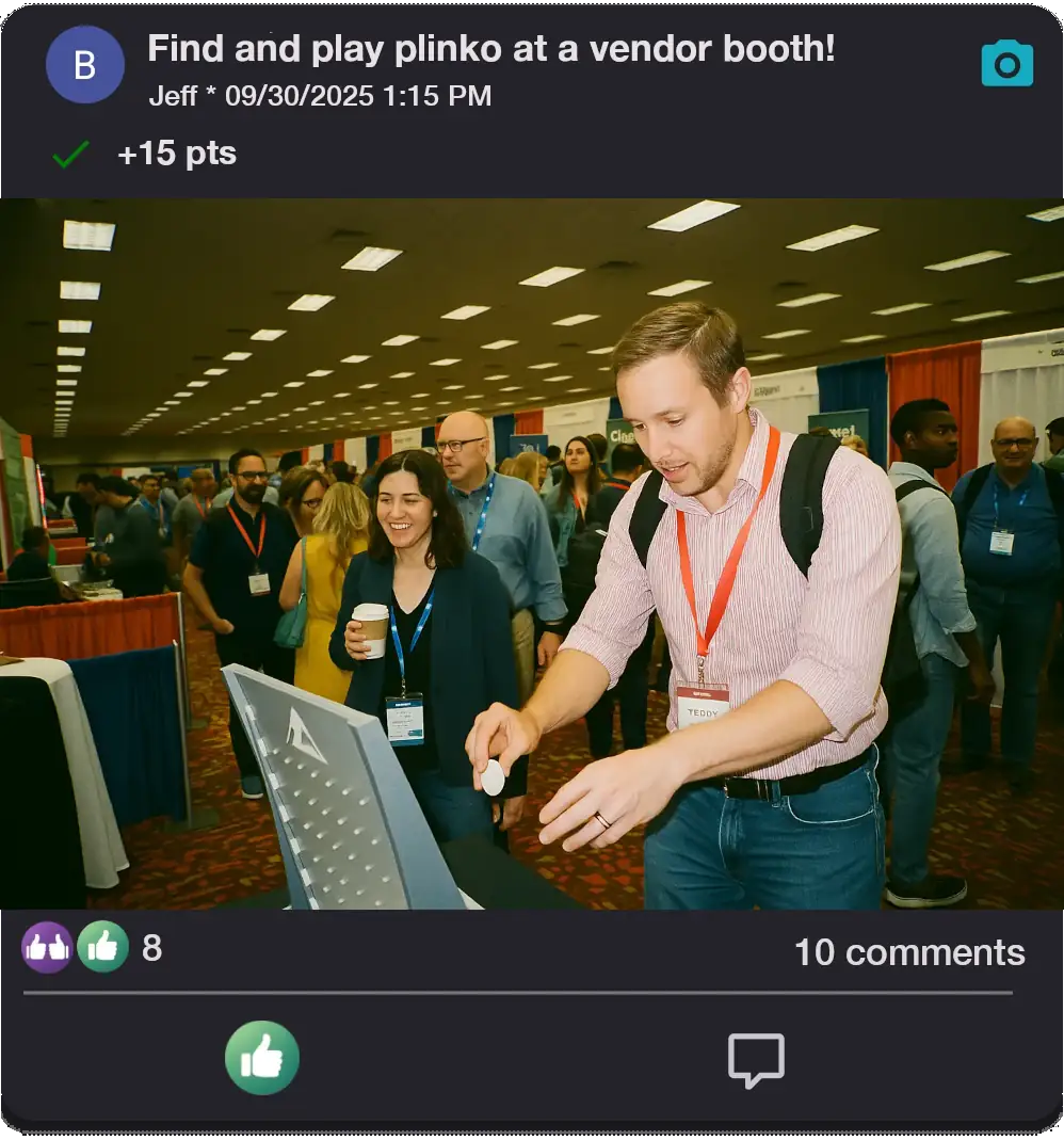 An excited crowd of conference attendees playing Plinko at a booth on the show floor