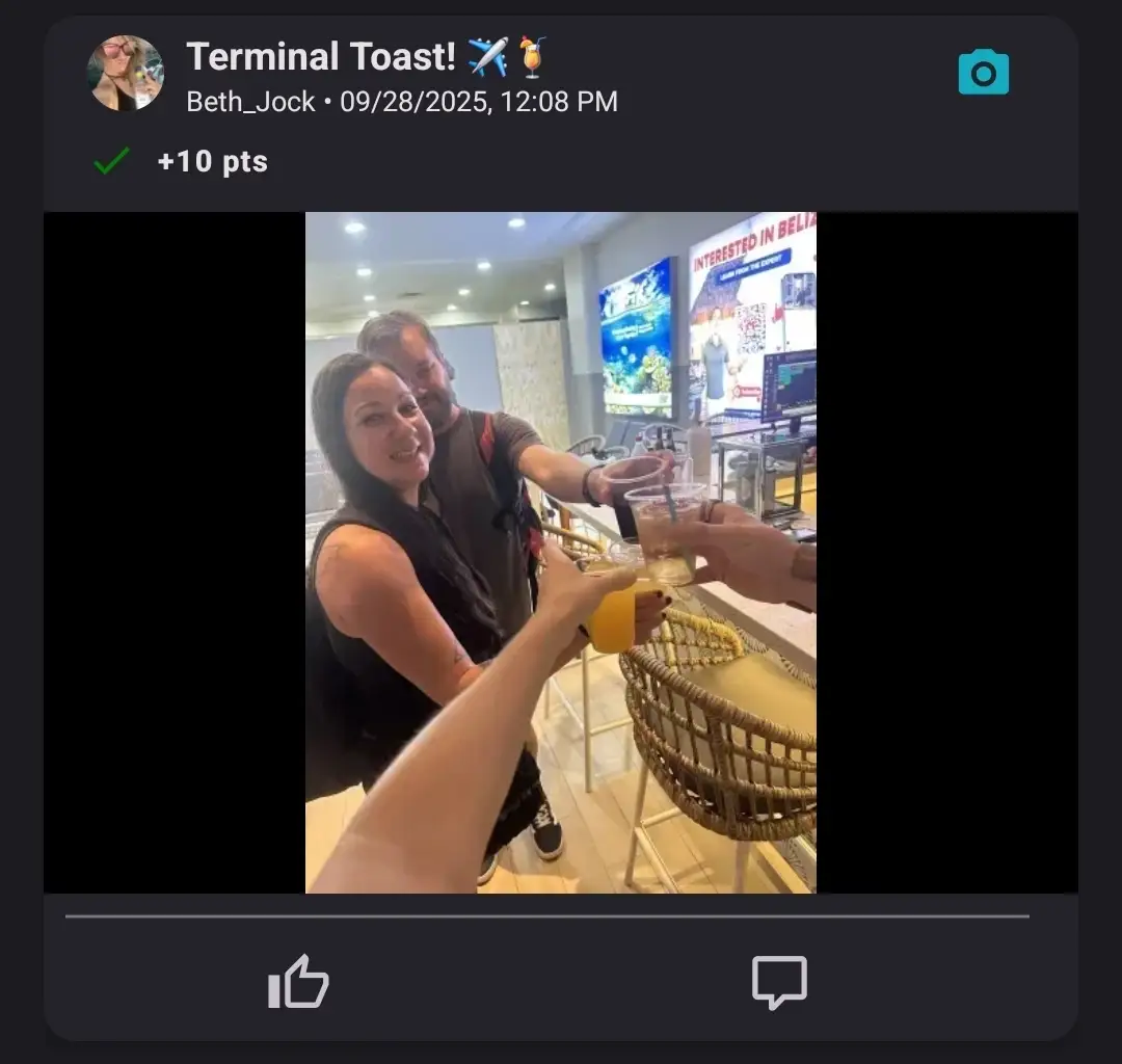 A group of friends raising their drinks together at an airport bar