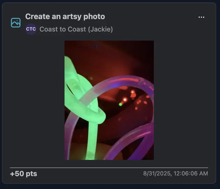A close-up shot of neon glow sticks intertwined against a dark backdrop, looking like abstract modern art at a rave.