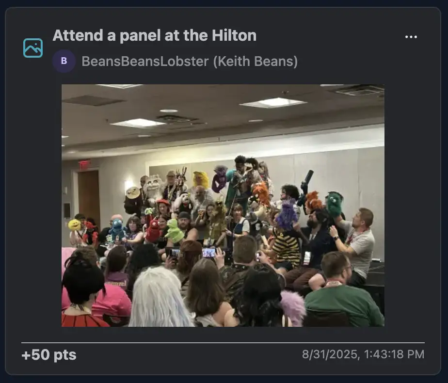 A lively Hilton panel packed with colorful puppet characters held up by their human handlers.