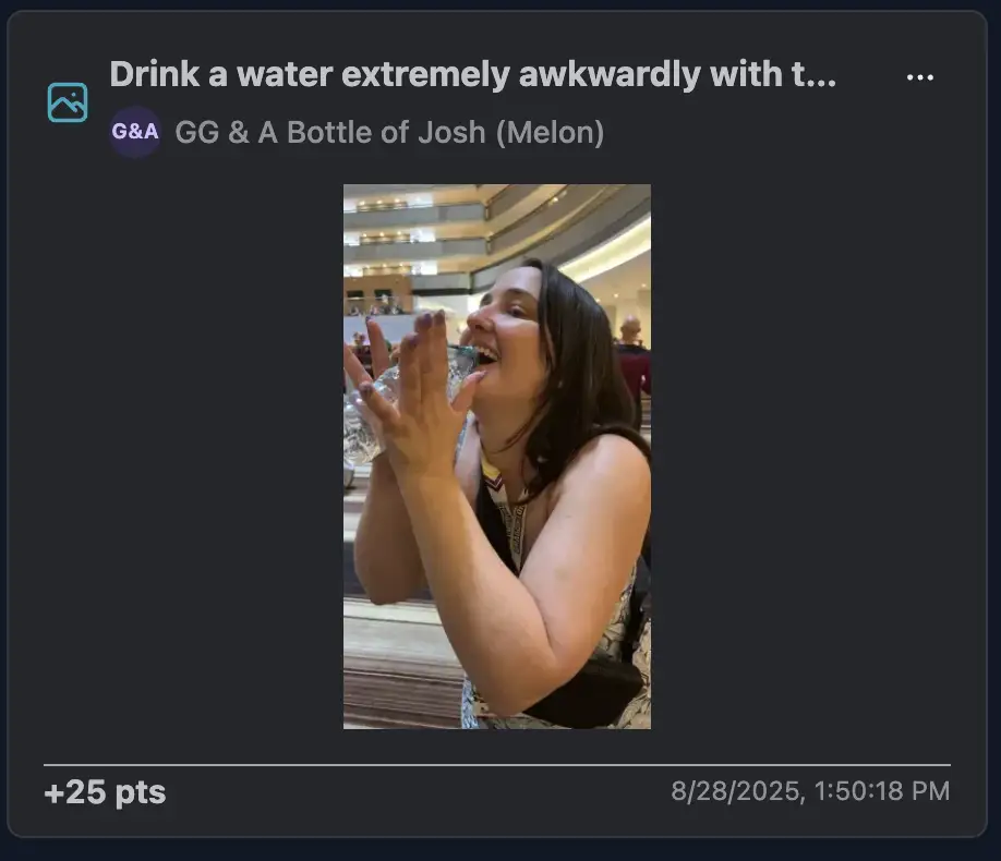 A player attempting to drink water with both hands intentionally very awkwardly.